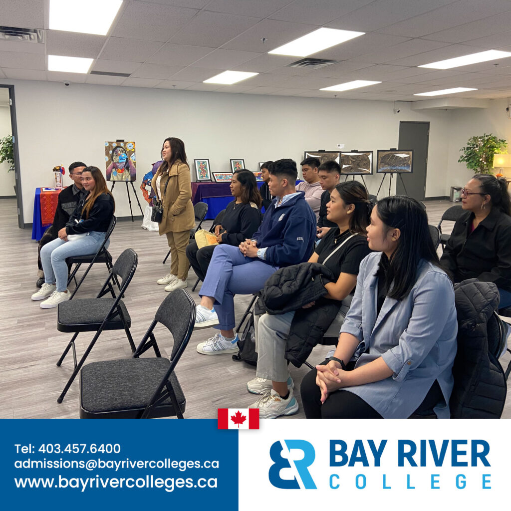 Bay River College international students from Philippines and Far Eastern University Manila FEU talking at Consulate General of the Philippines in Calgary Alberta Canada