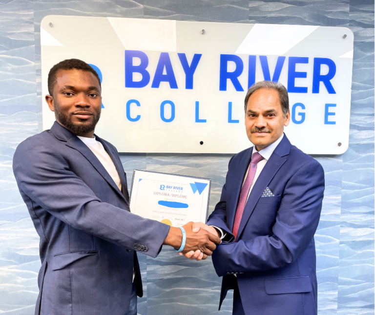 Process Piping and Drafting student at Bay River College receiving diploma.