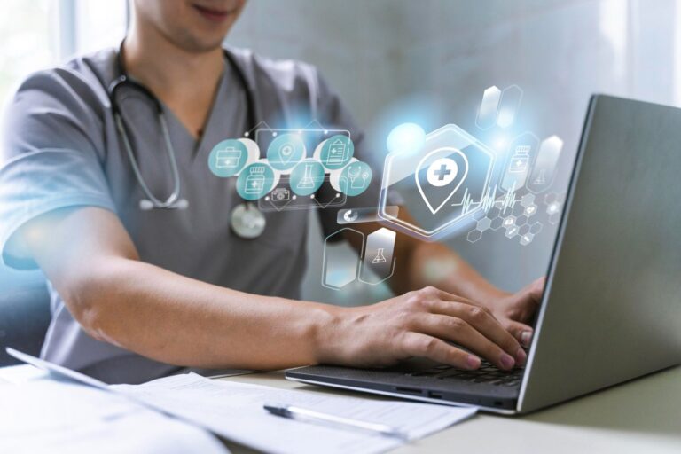 Doctor using a laptop to provide telemedicine consultation, showcasing the integration of technology in modern healthcare.