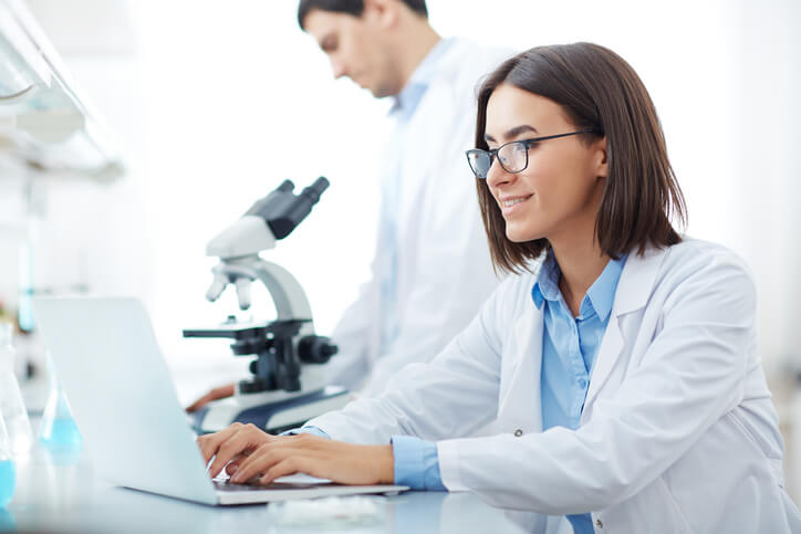 A career college grad working on clinical research in a lab