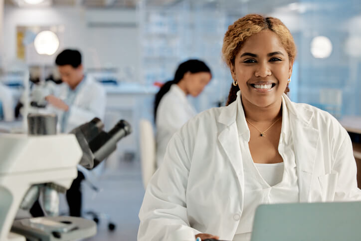 A career college grad working on clinical research in a lab