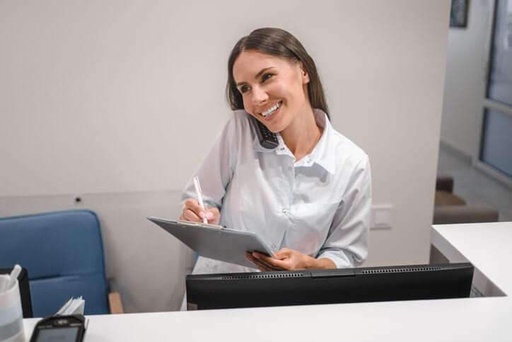 A Medical admin working at clinic reception