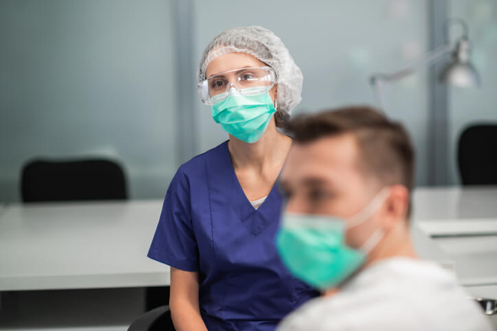 An IPAC student learning infection control procedures