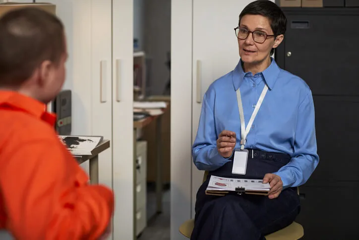Community support worker skills, including active listening, during a one-on-one client conversation