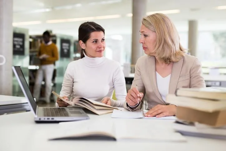 A career college advisor explaining work-integrated learning options