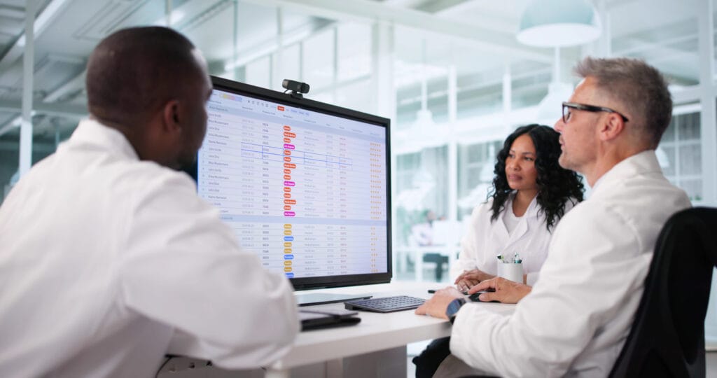 Clinical research staff monitoring patient data during a clinical trial