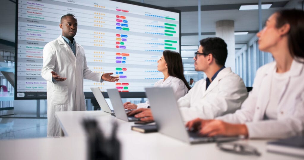 Clinical research coordinator reviewing study protocols with a research team