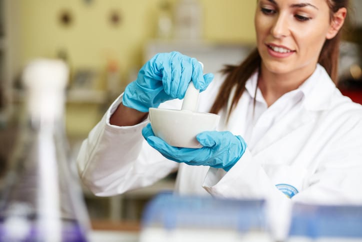 In-person training provides hands-on practice in realistic pharmacy labs.
