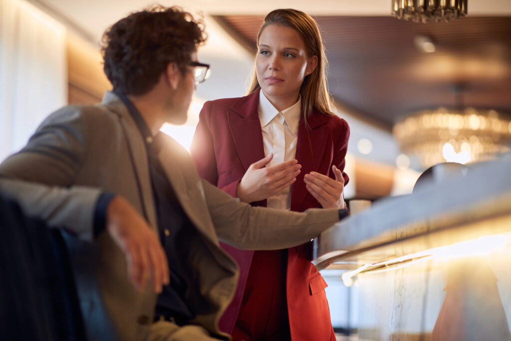 A hospitality professional using empathy to resolve a guest concern