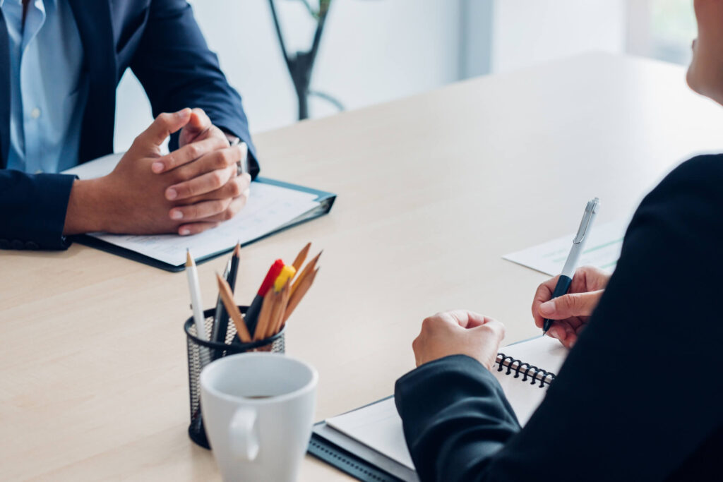 Hiring manager interviewing an Education Assistant applicant