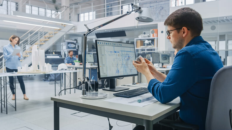 A designer reviewing process piping systems in a collaborative digital workspace